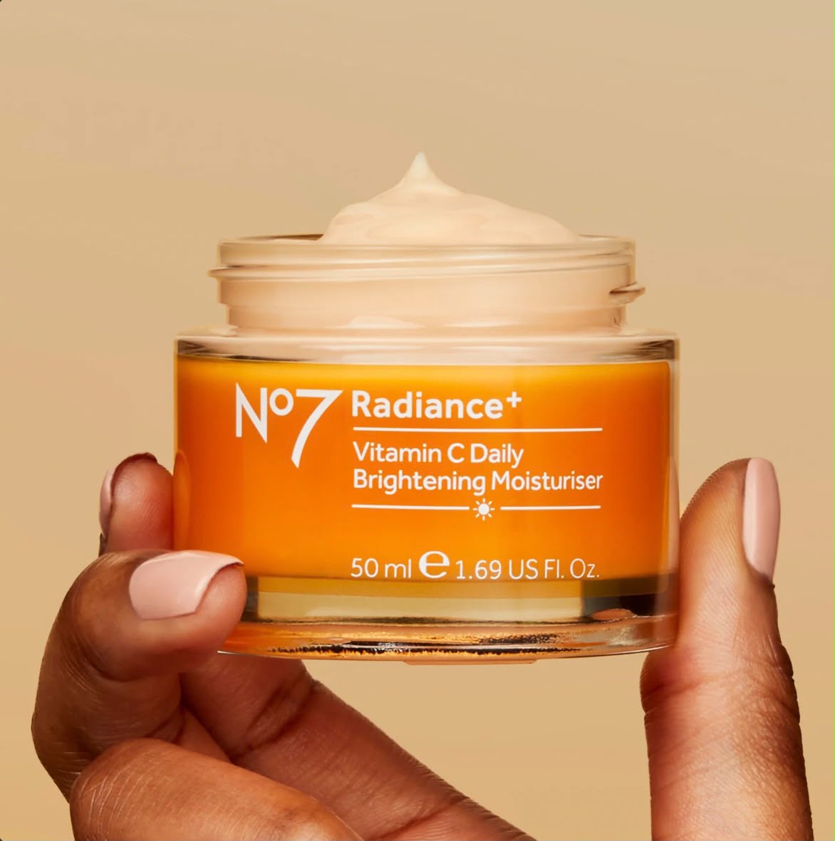 No7 Radiance+ Vitamin C Daily Brightening Moisturiser 50ml jar held in hand