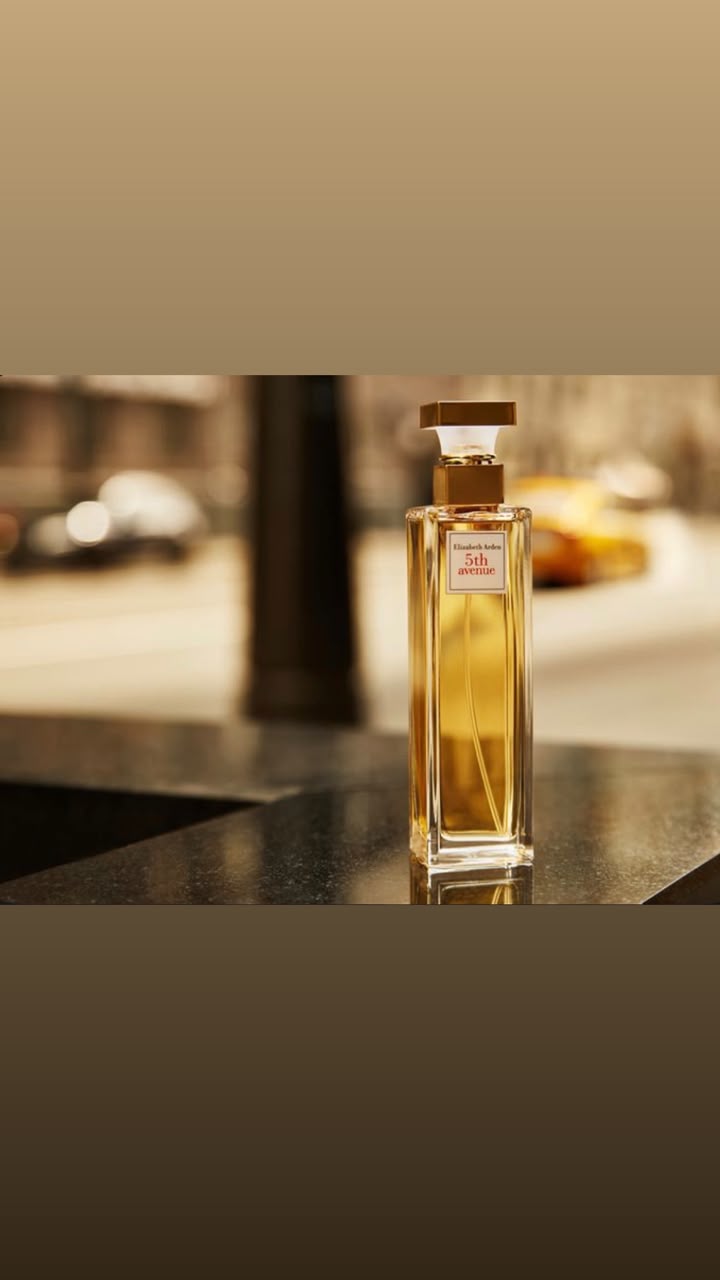 Elizabeth Arden 5th Avenue eau de parfum bottle on a city street setting