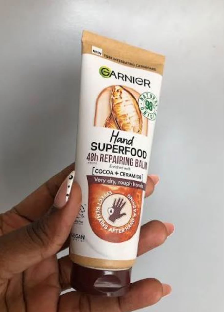 Garnier Hand Superfood 48h repairing balm with cocoa and ceramide held in hand